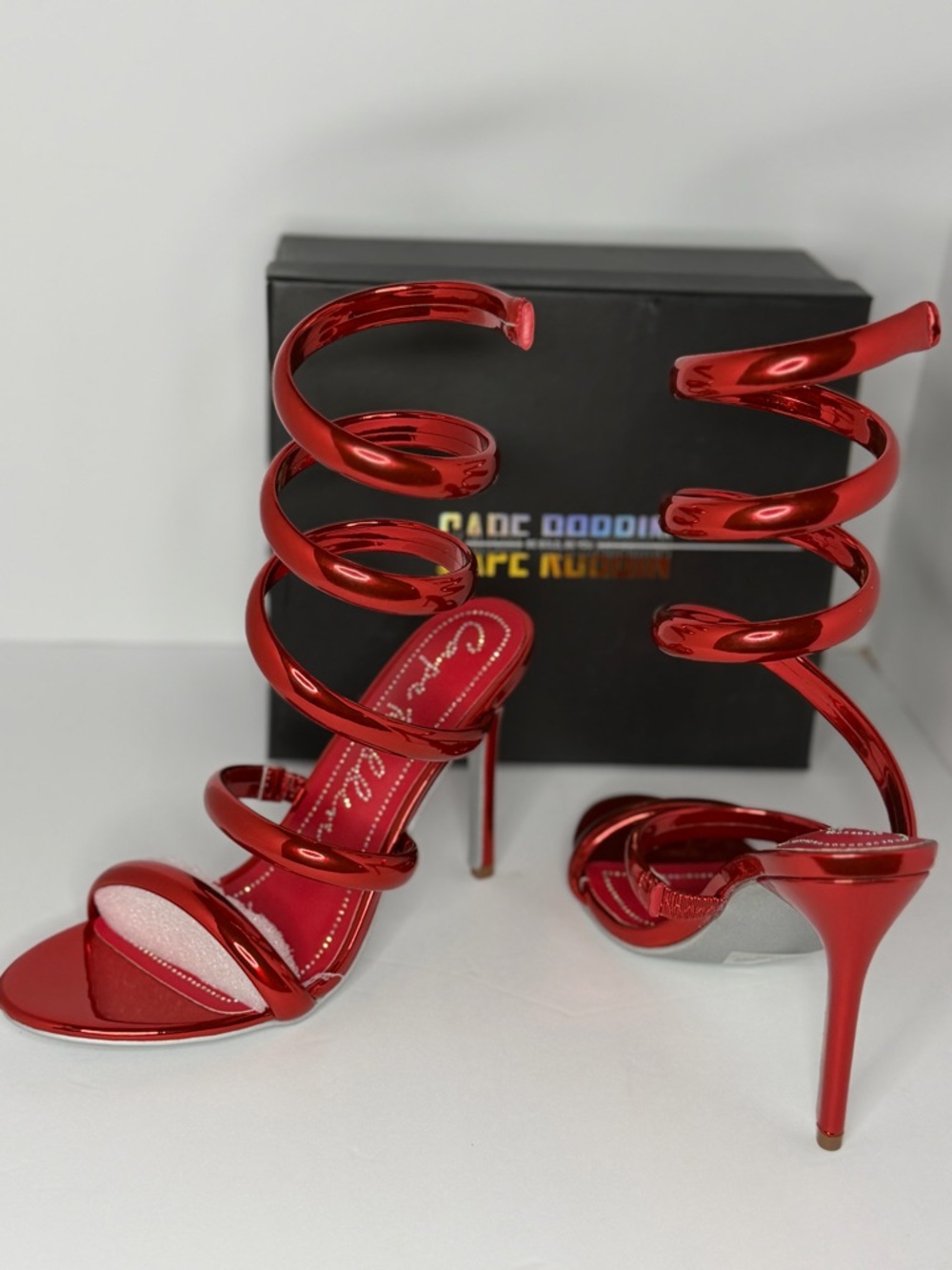 Red metallic spiral wrap heels